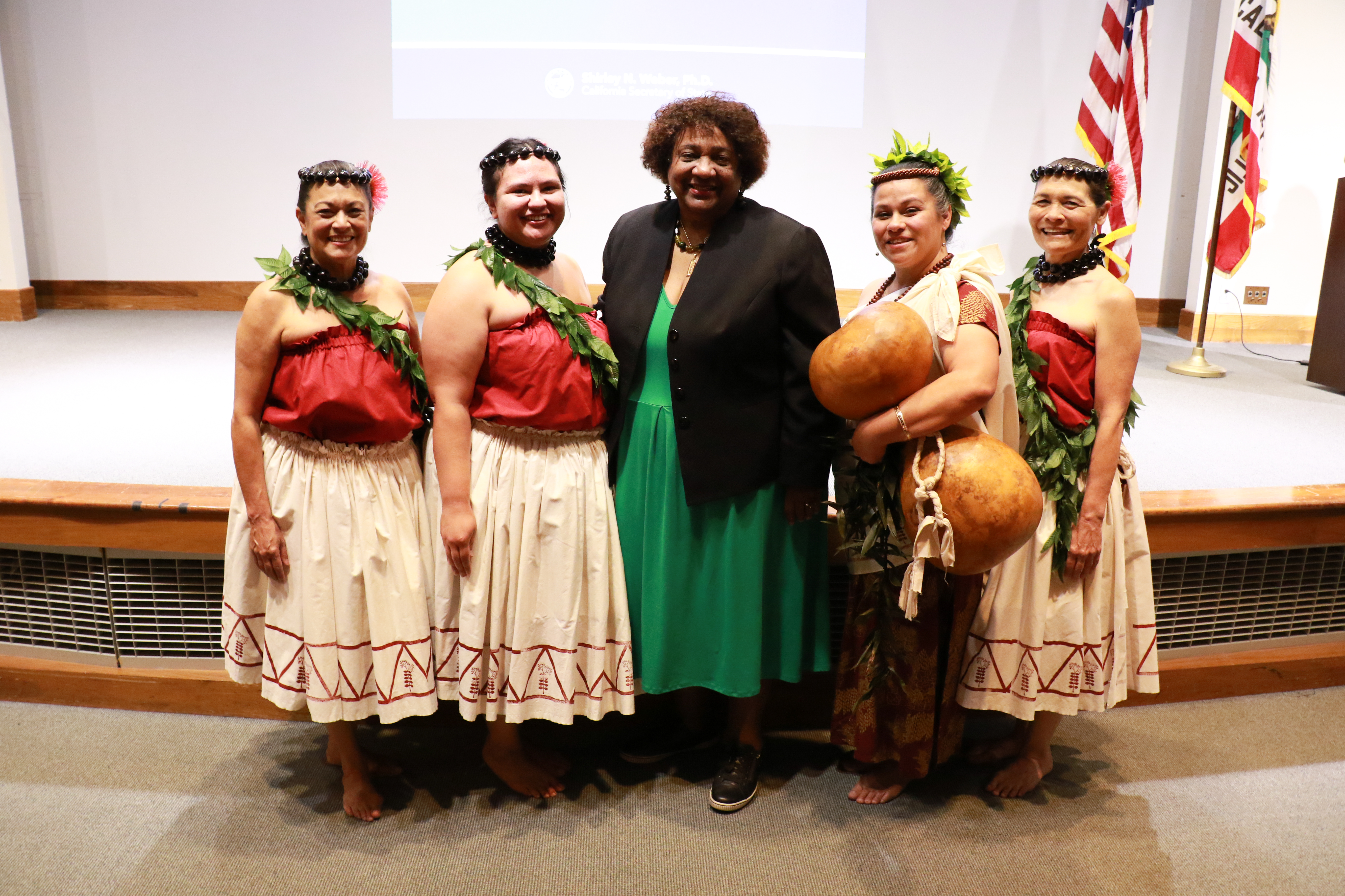 Secretary Weber and four dancers stand for a photo.